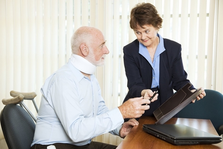 lawyer help man in a neck brace