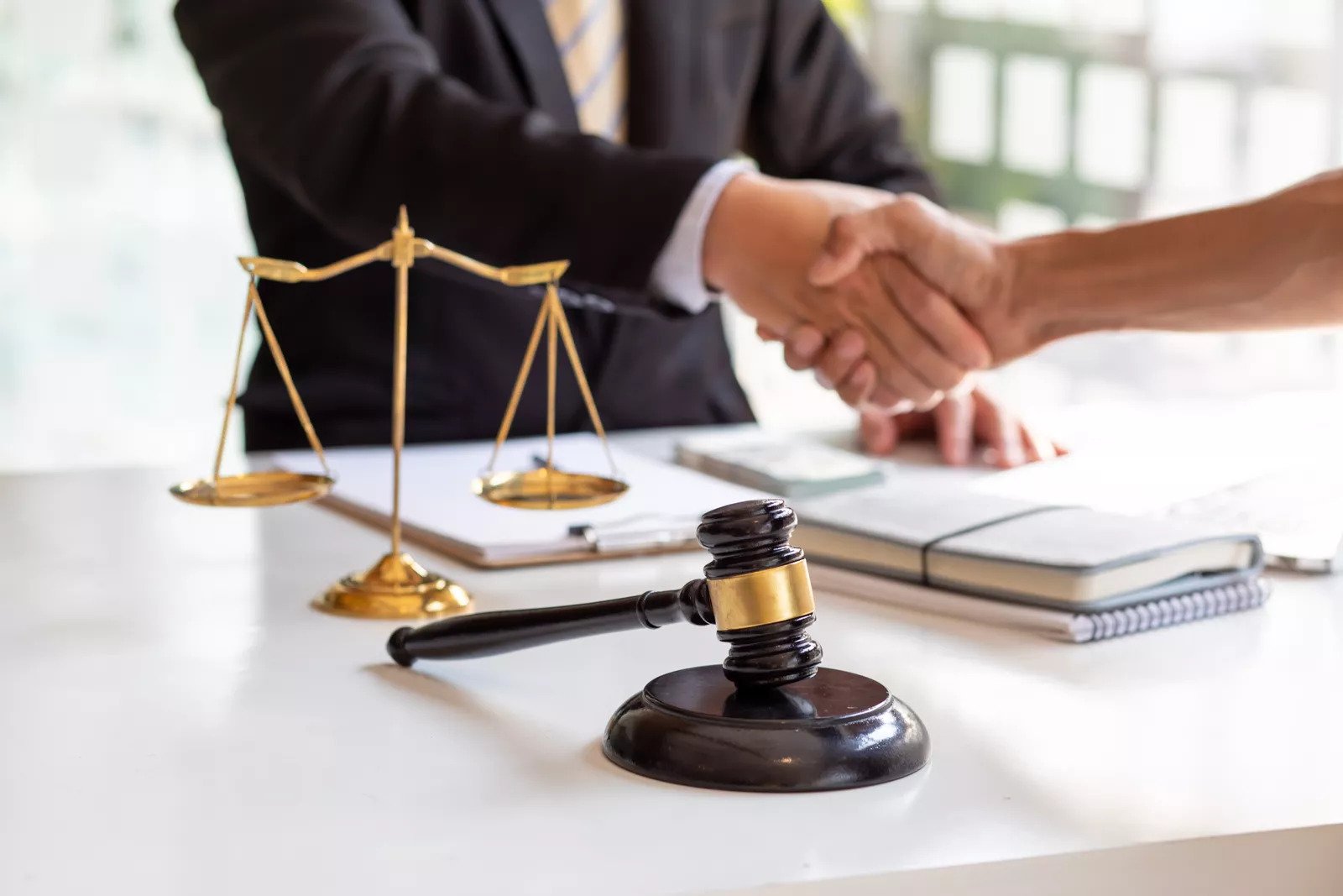 man and lawyer shaking hands